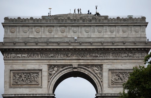 French security on rooftops and rivers overlooking Paris