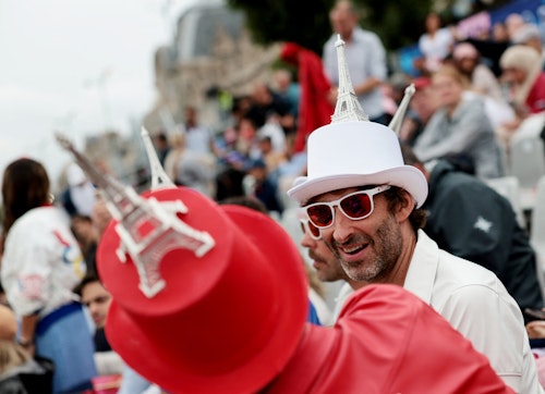 Fans bedecked in stars, stripes and miniature Eiffel Tower hats to celebrate Olympics opening 