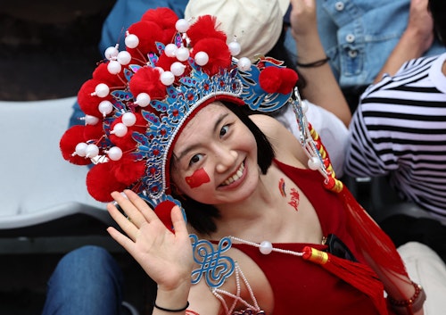 Fans bedecked in stars, stripes and miniature Eiffel Tower hats to celebrate Olympics opening 