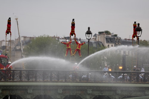 Water and light shows amid drizzle