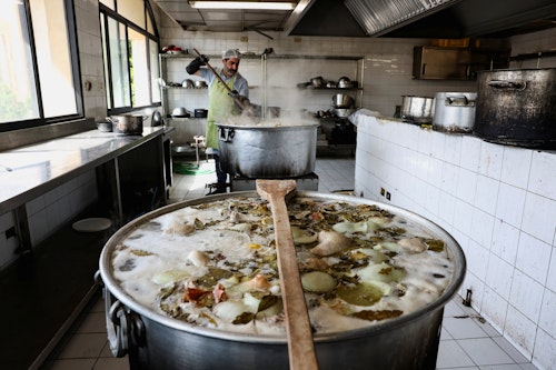Volunteers prepare food for the displaced in Beirut