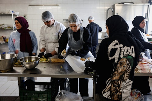 Volunteers prepare food for the displaced in Beirut