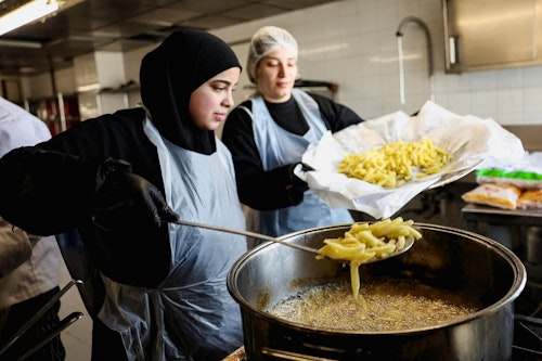Volunteers prepare food for the displaced in Beirut