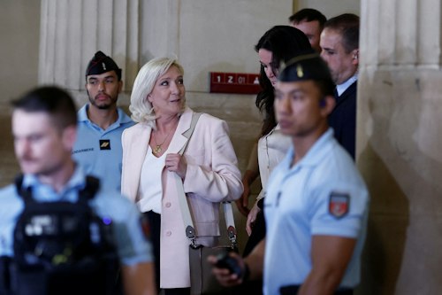 In pictures: Le Pen leaving court earlier